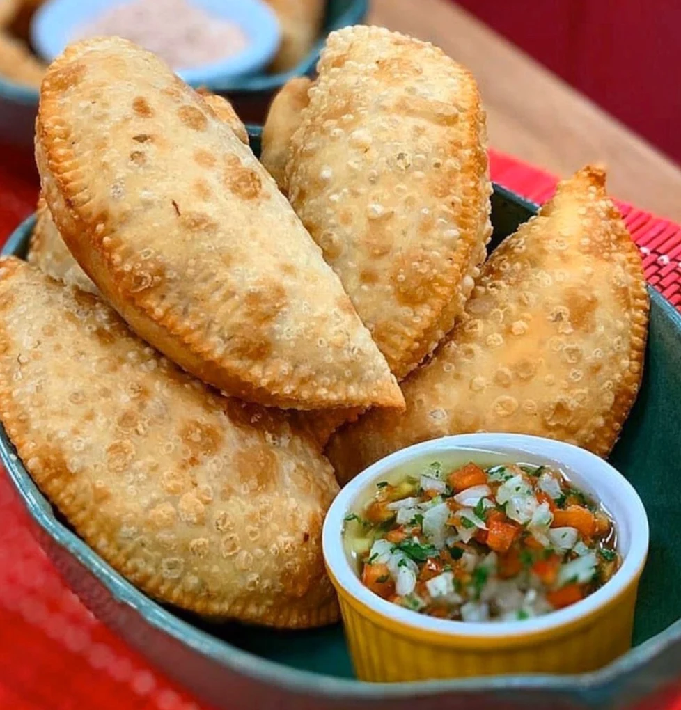 Two empanadas with a frozen drink